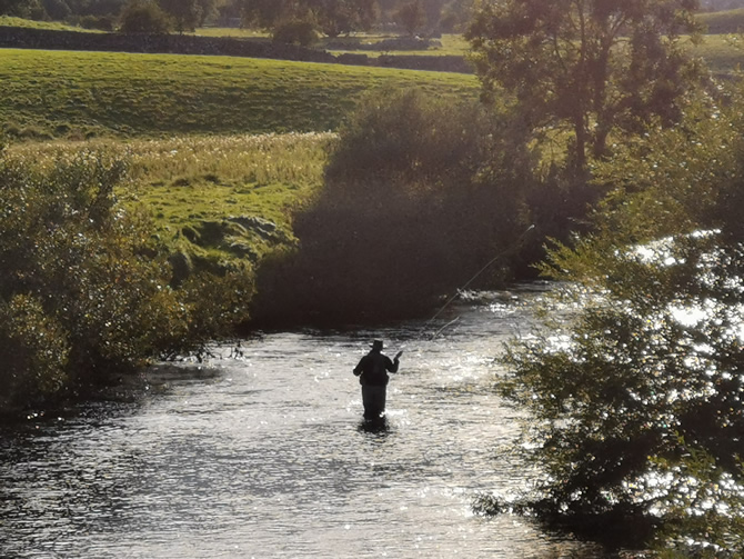 Fishing in the River Ure near Askrigg in Wensleydale